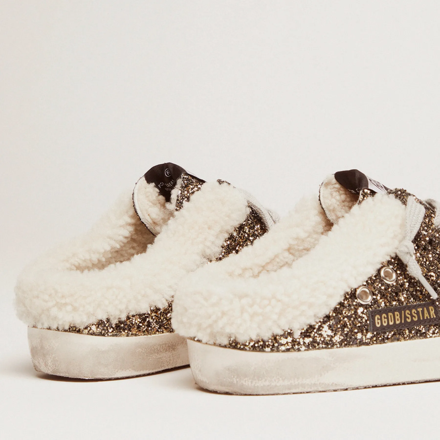 GOLDEN GOOSE SUPER STAR SABOT SNEAKERS IN BLACK & GOLD WITH SHEARLING LINING
