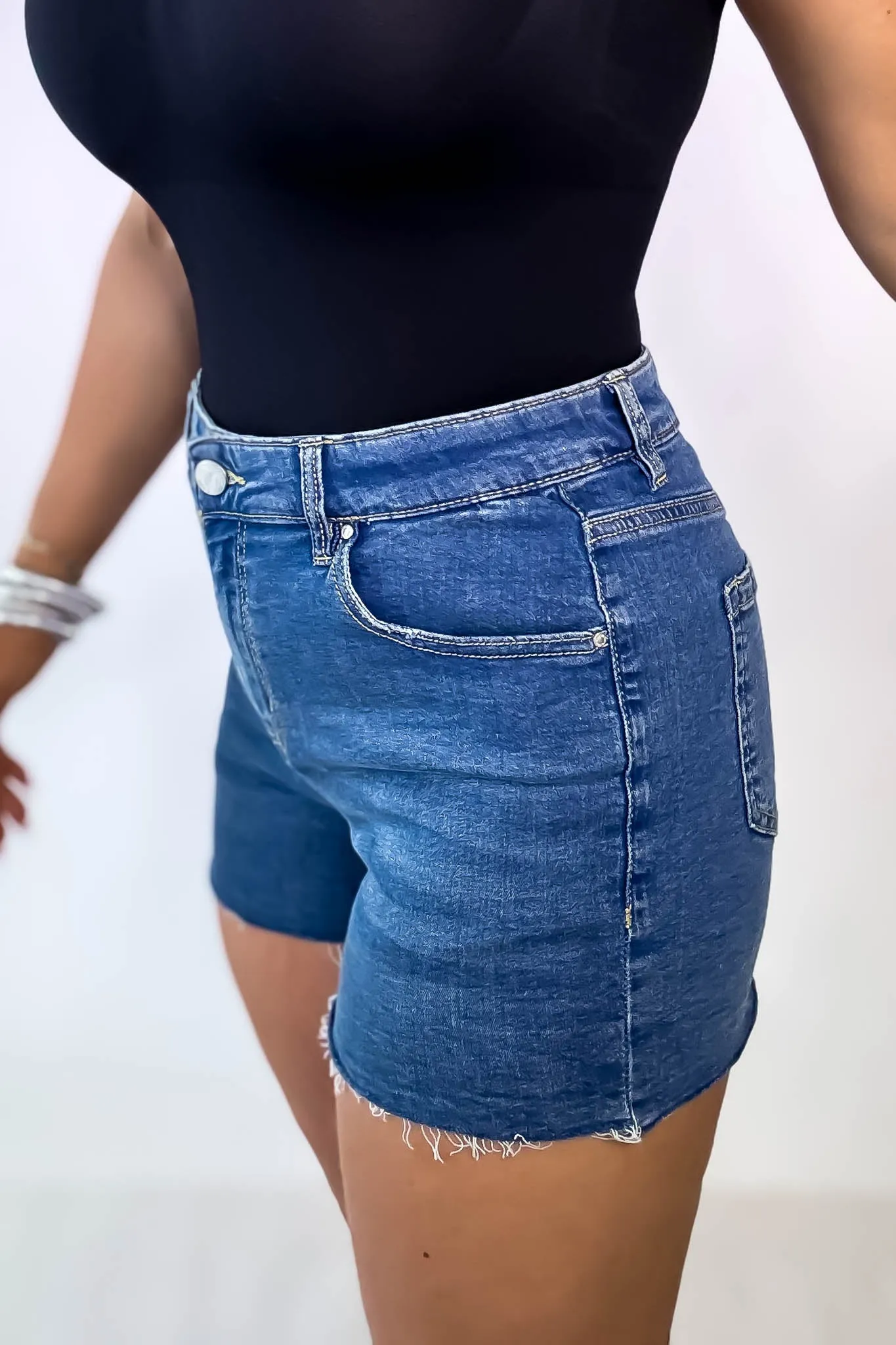 High Rise Medium Wash Frey Hem Denim Shorts
