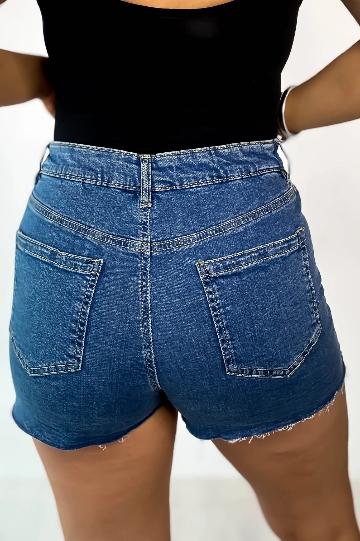 High Rise Medium Wash Frey Hem Denim Shorts