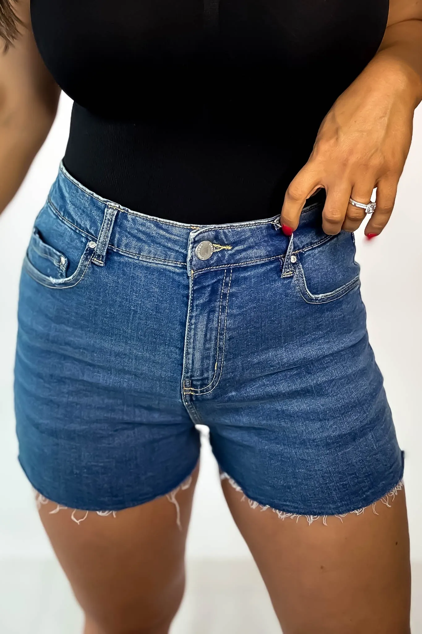 High Rise Medium Wash Frey Hem Denim Shorts